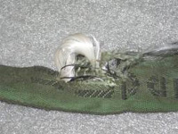 Rundschlinge mit beschädigter Ummantelung